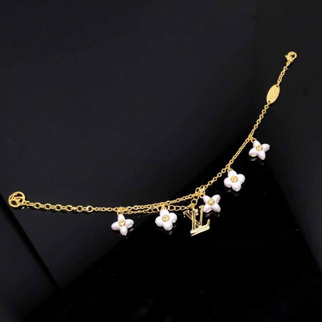 [⭐DORISW] LOGO ARMBAND MIT 6 STERN- UND SONNENMOTIVEN IN GOLD