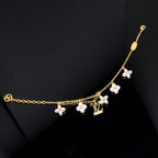 [⭐DORISW] LOGO ARMBAND MIT 6 STERN- UND SONNENMOTIVEN IN GOLD