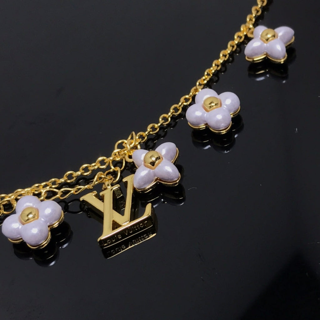 [⭐DORISW] LOGO ARMBAND MIT 6 STERN- UND SONNENMOTIVEN IN GOLD