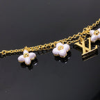 [⭐DORISW] LOGO ARMBAND MIT 6 STERN- UND SONNENMOTIVEN IN GOLD
