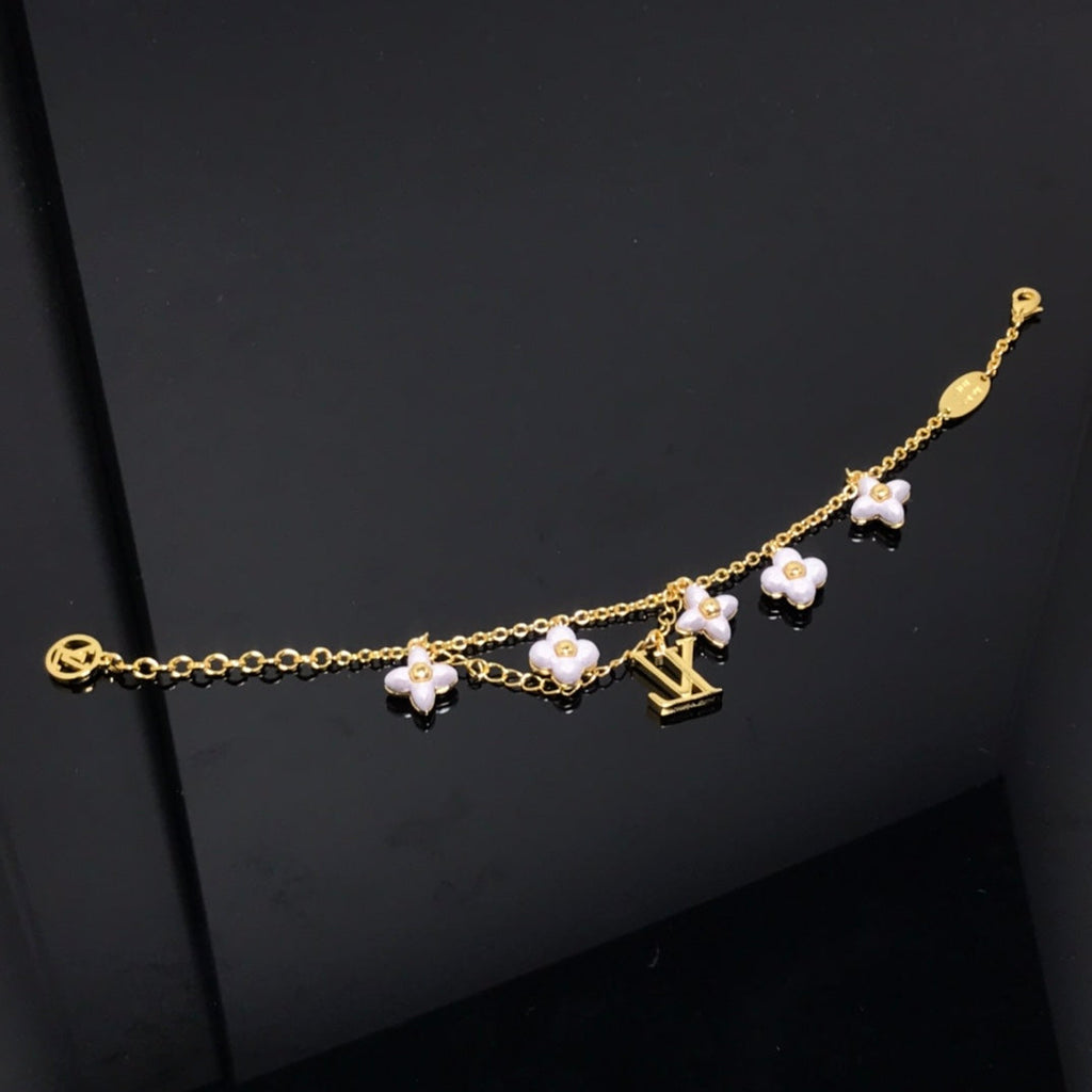 [⭐DORISW] LOGO ARMBAND MIT 6 STERN- UND SONNENMOTIVEN IN GOLD