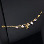 [⭐DORISW] LOGO ARMBAND MIT 6 STERN- UND SONNENMOTIVEN IN GOLD